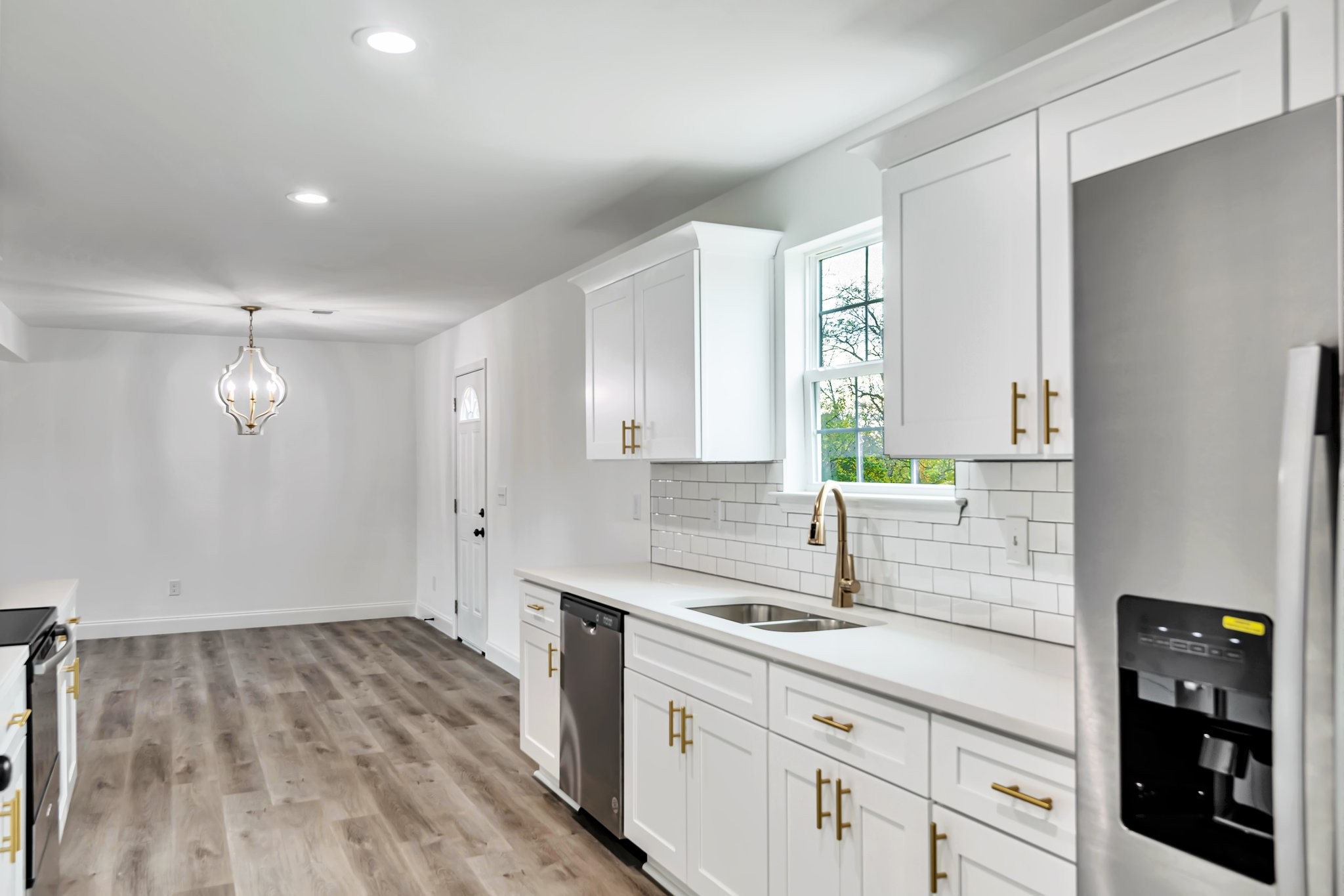 420 Larkin Springs Road Madison, TN 37115 - Photo 5 of 27 a kitchen with granite countertop a sink cabinets and wooden floor