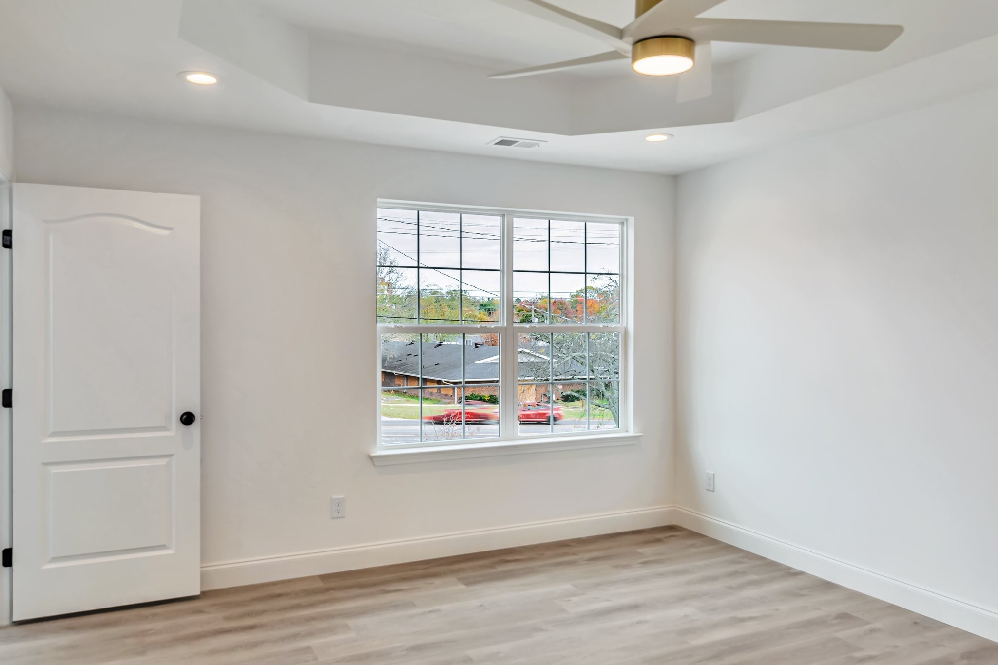 420 Larkin Springs Road Madison, TN 37115 - Photo 10 of 27 an empty room with window and wooden floor
