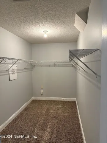 a view of a room with racks on the wall