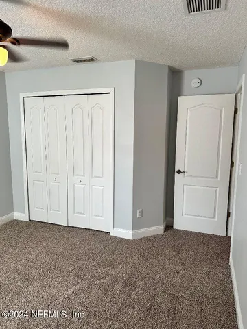 a view of room with hardwood floor