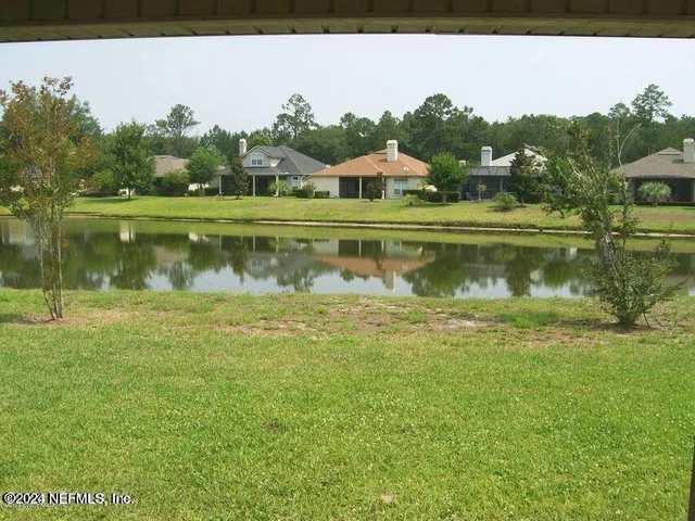 a view of a lake with a yard