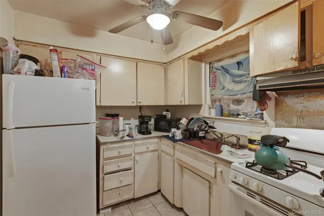 a kitchen with a refrigerator and cabinets