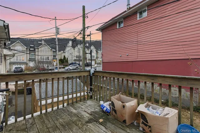 a view of a chair and table on the deck