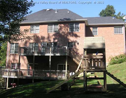 1399 Bedford Road Charleston, WV 25314 - Photo 15 of 16 Exterior Front. All brick, main deck off kitchen and first floor family room. Lower deck off theater/recreation room. Gutterpro gutters w/25 yr. warranty (2005)