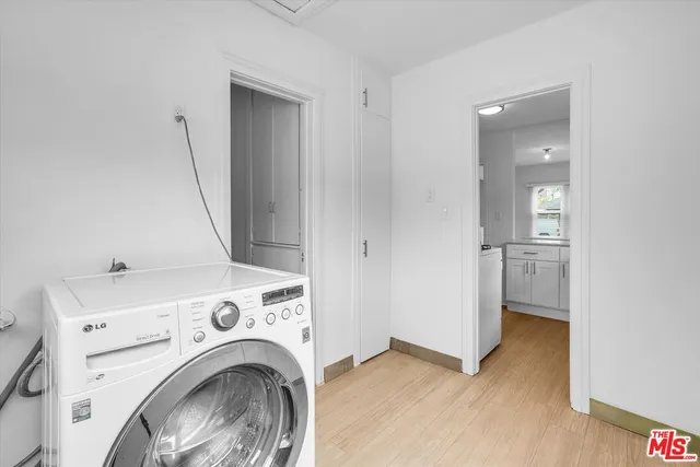 a view of livingroom with washer and dryer