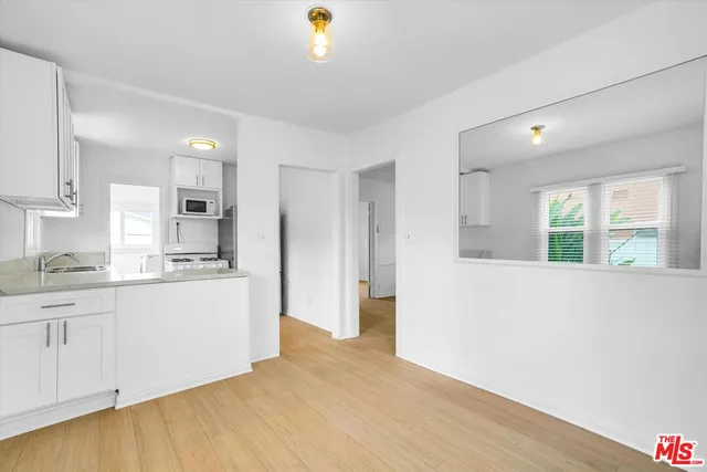 a view of kitchen with wooden floor