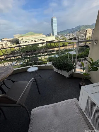 a view of a balcony with chairs