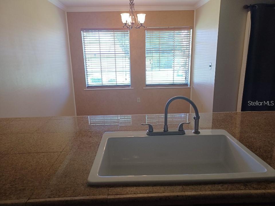 701 Perkins Street, Unit 203 Leesburg, FL 34748 - Photo 7 of 13 a close view of sink and tap