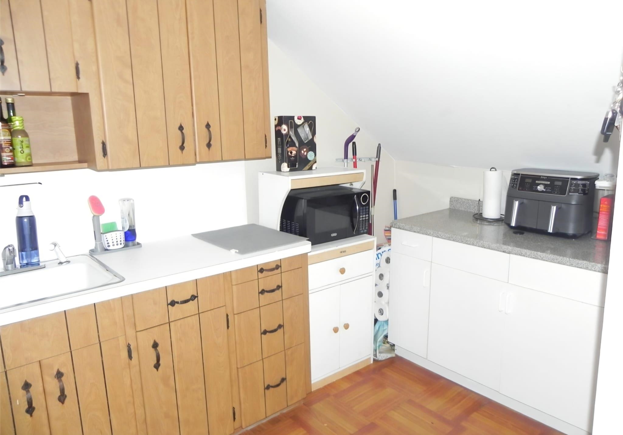 114 Mehrhof Road Little Ferry, NJ 07643 - Photo 25 of 28 a kitchen with cabinets a sink and a stove