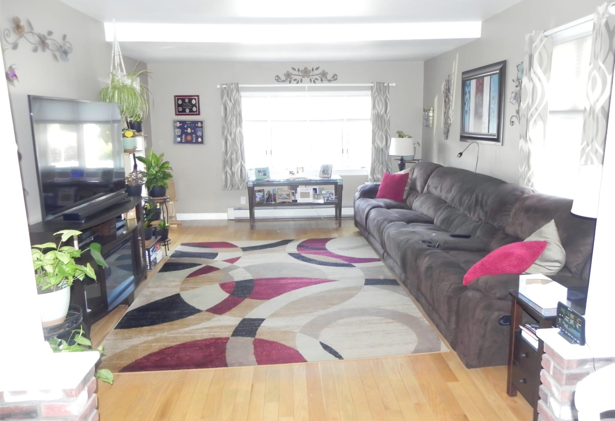 114 Mehrhof Road Little Ferry, NJ 07643 - Photo 4 of 28 a living room with furniture and a large window