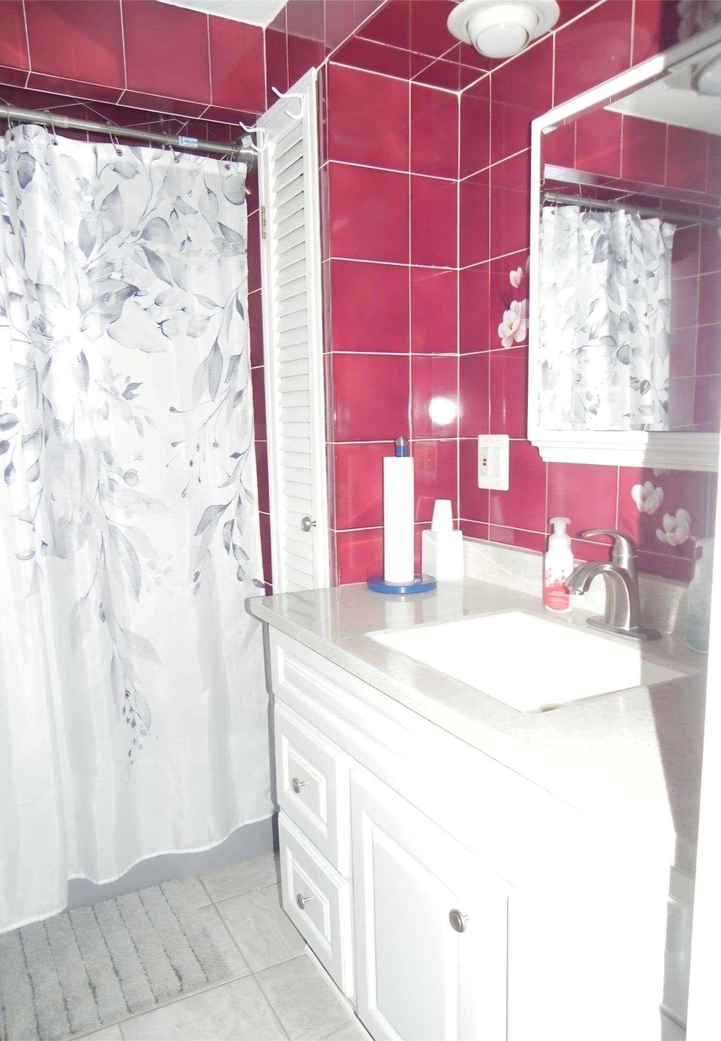 114 Mehrhof Road Little Ferry, NJ 07643 - Photo 8 of 28 a bathroom with a sink and a mirror