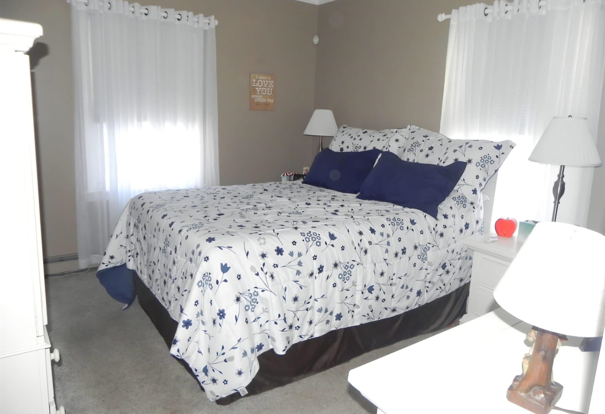 114 Mehrhof Road Little Ferry, NJ 07643 - Photo 10 of 28 a bedroom with a bed and a window