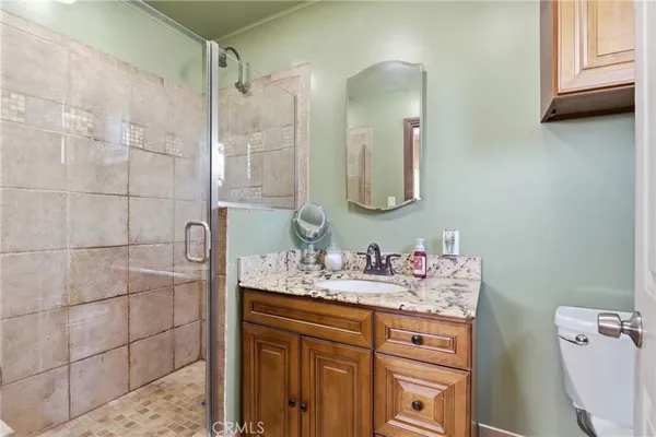 a bathroom with a sink vanity and mirror