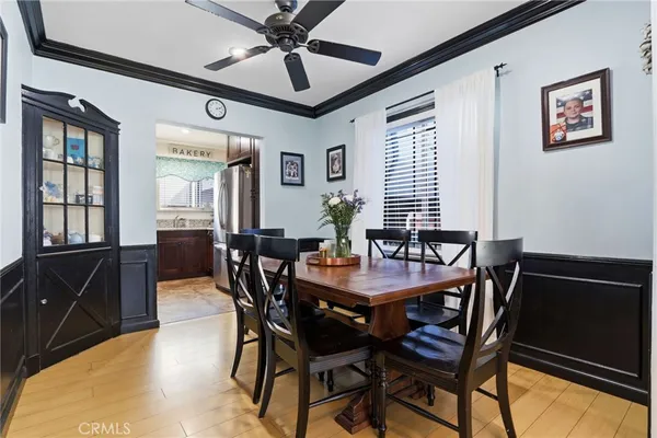 a view of a dining room with furniture and window