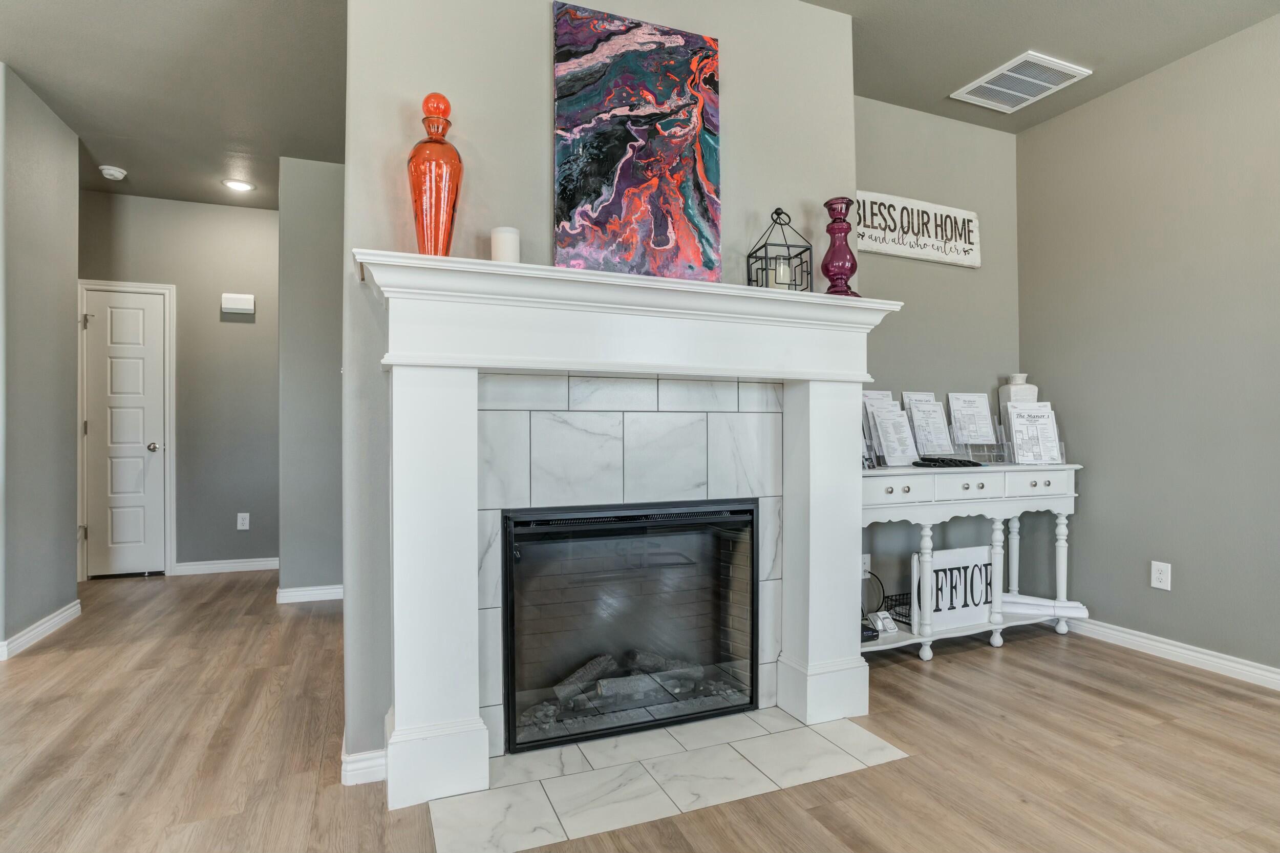 6928 11th Street Lubbock, TX 79416 - Photo 11 of 42 a living room with furniture and a fireplace