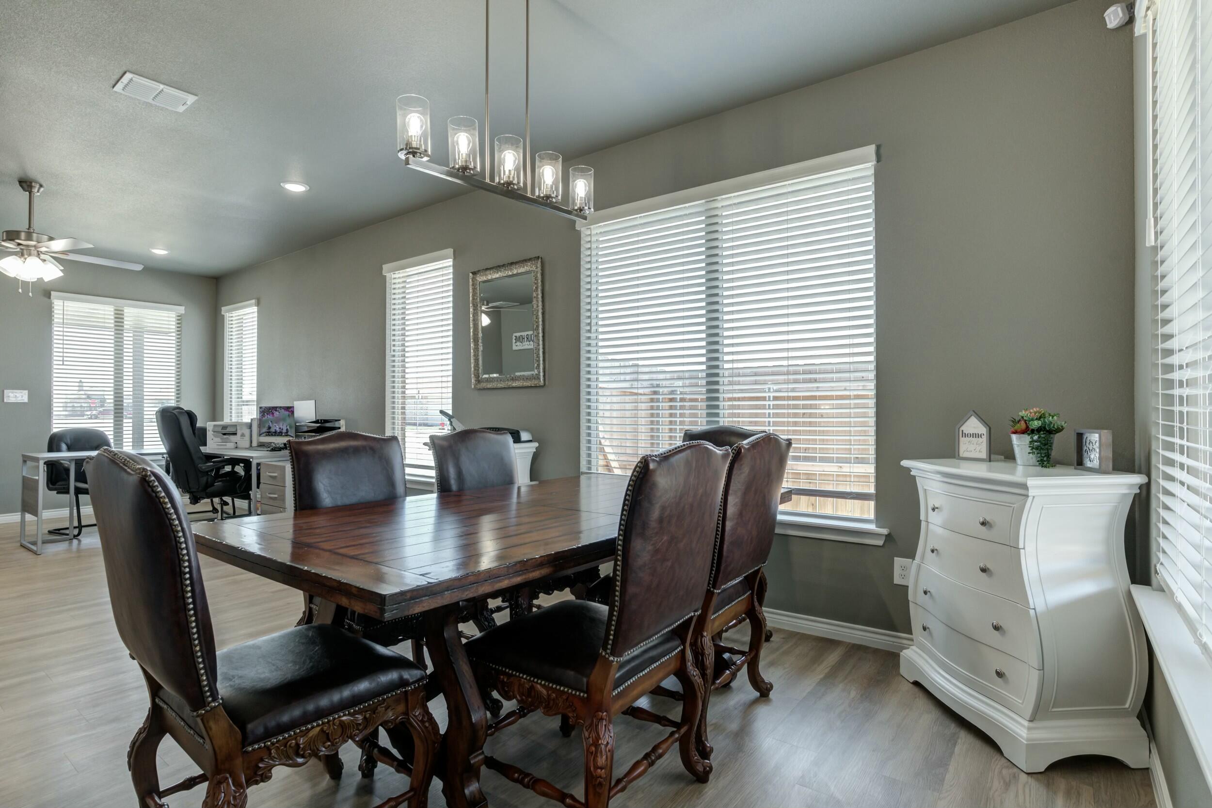 6928 11th Street Lubbock, TX 79416 - Photo 13 of 42 a view of a dining room with furniture