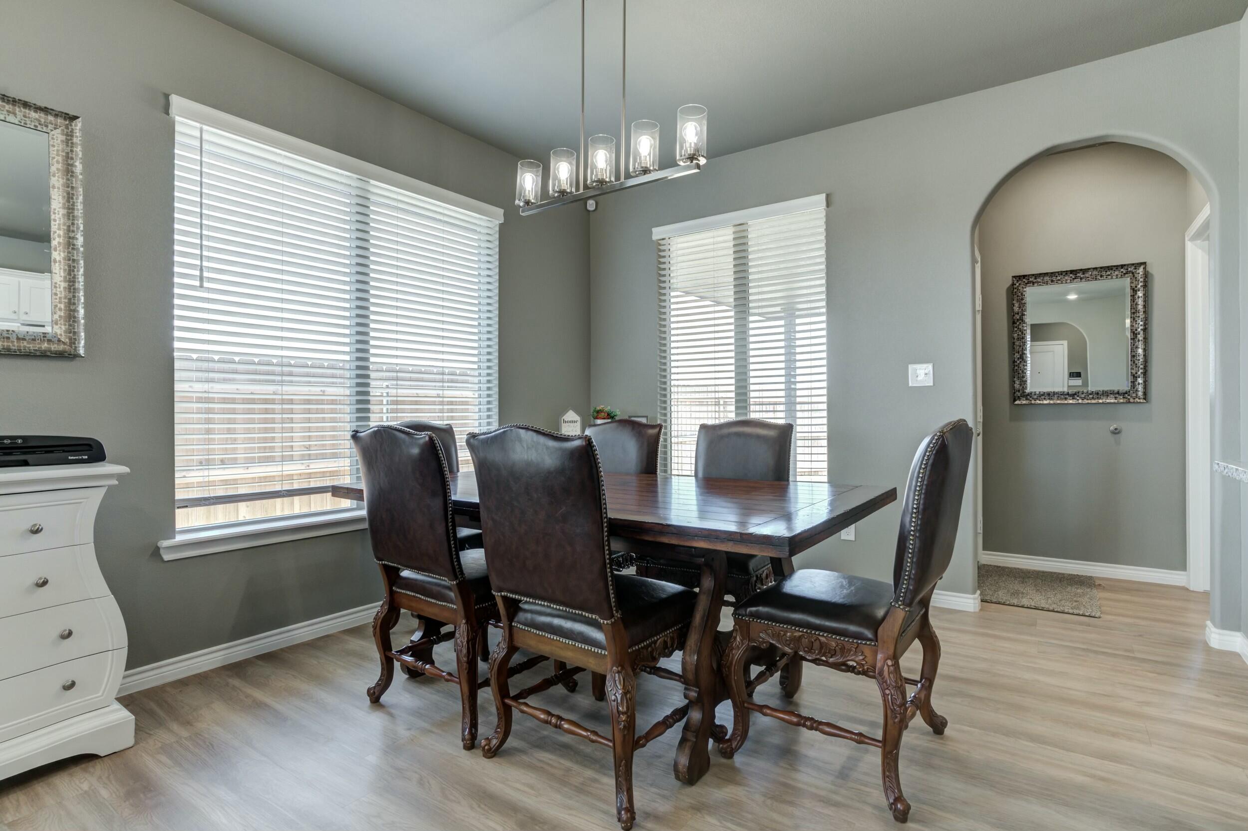 6928 11th Street Lubbock, TX 79416 - Photo 14 of 42 a view of a dining room with furniture and window