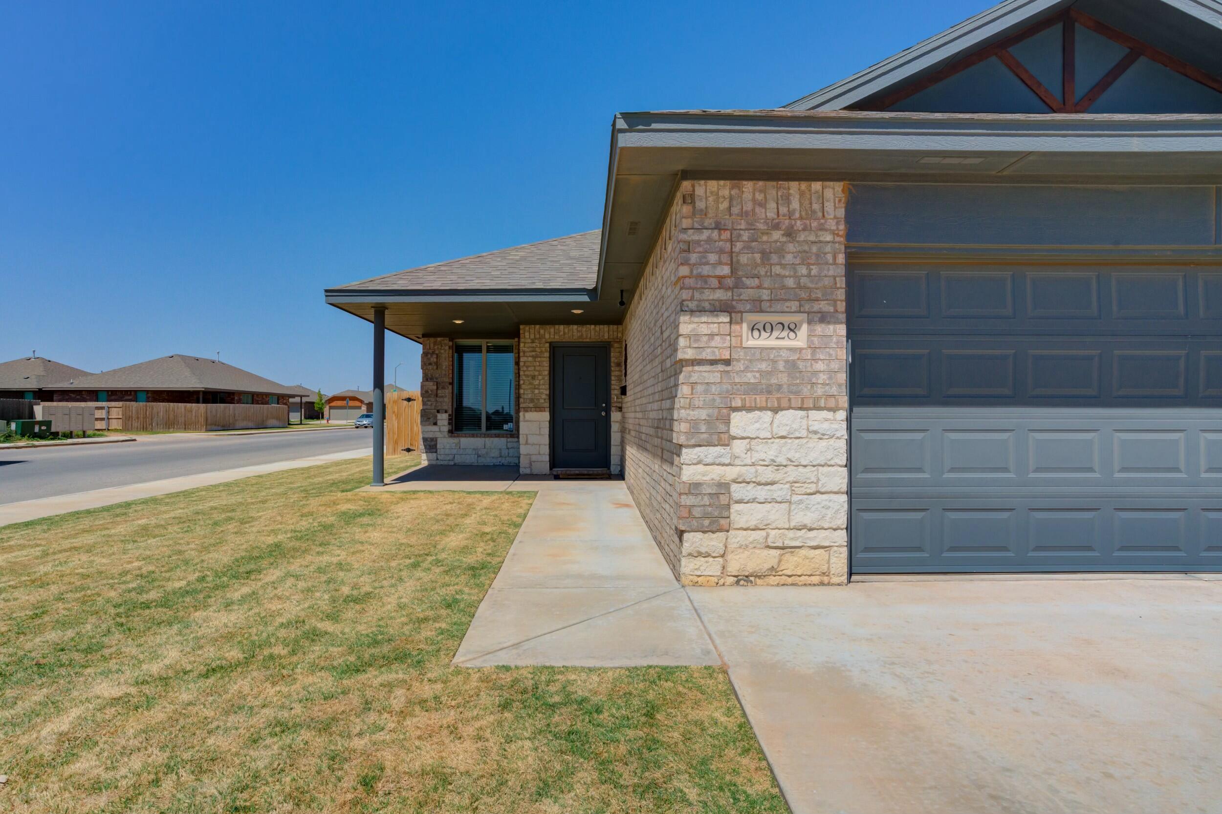 6928 11th Street Lubbock, TX 79416 - Photo 2 of 42 a view of house with outdoor space