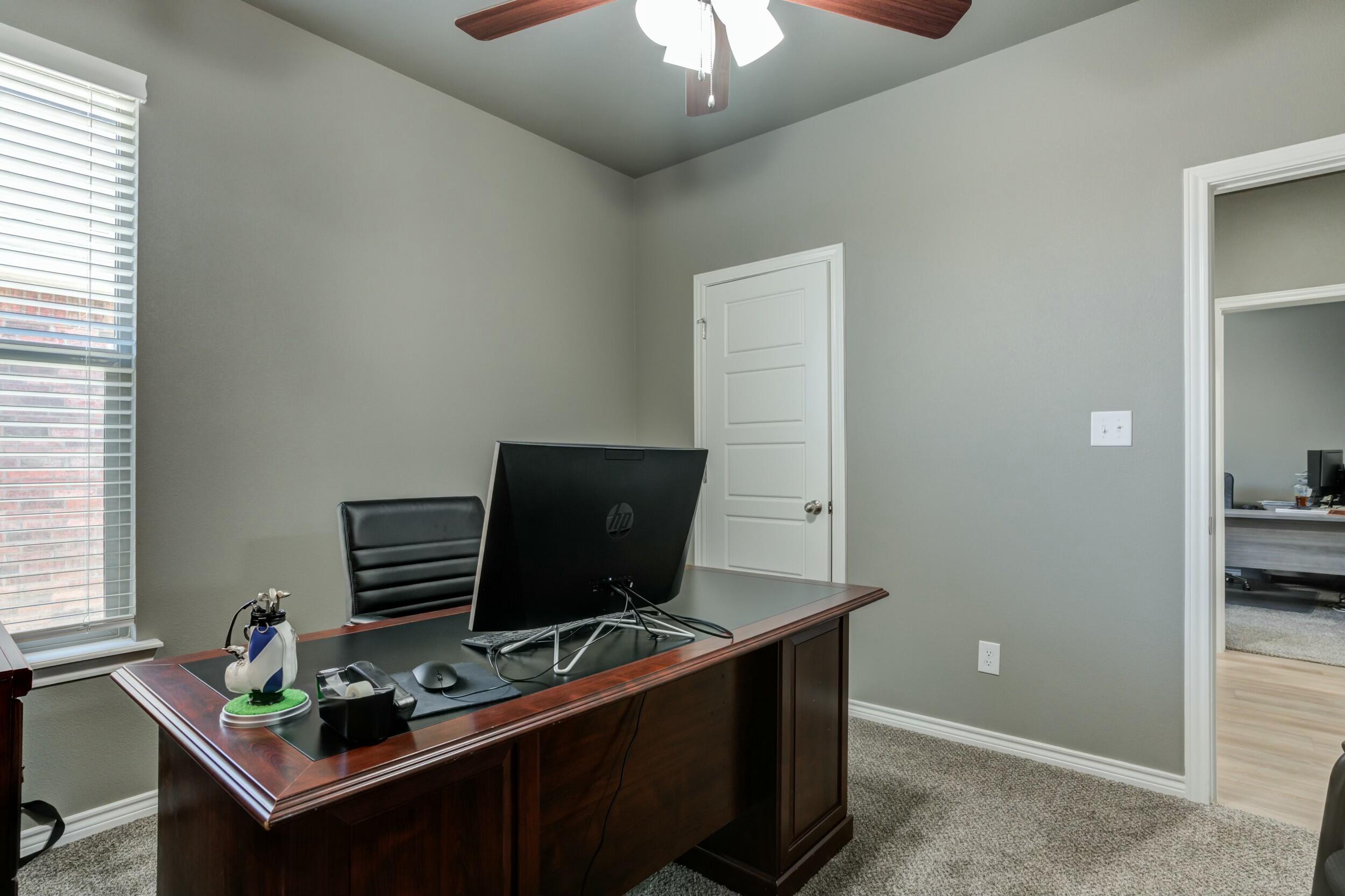 6928 11th Street Lubbock, TX 79416 - Photo 31 of 42 a view of workspace with furniture