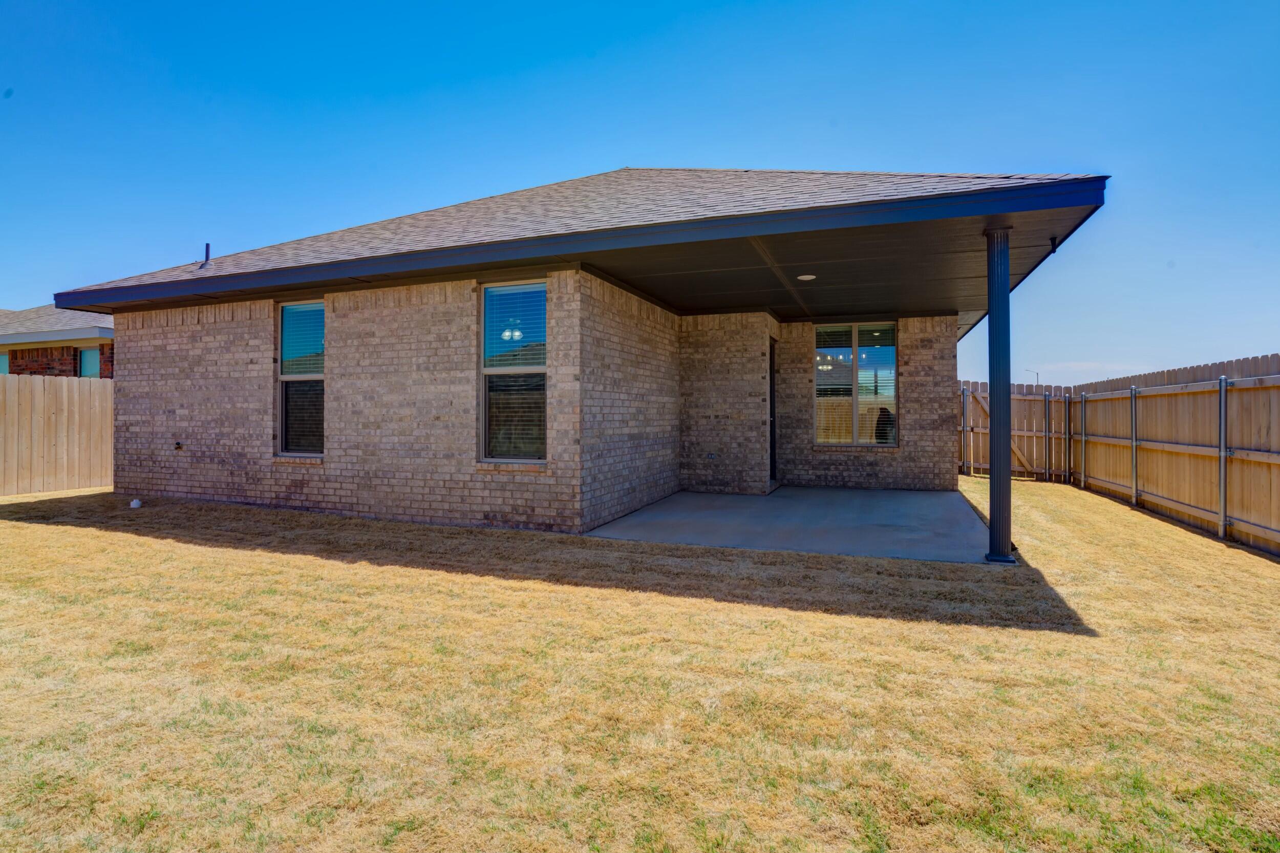 6928 11th Street Lubbock, TX 79416 - Photo 41 of 42 a view of back yard of the house