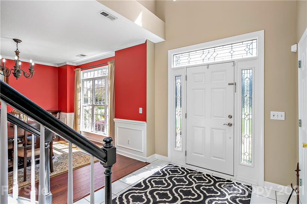 883 Knightsbridge Road Fort Mill, SC 29708 - Photo 2 of 20 a view of a hallway with wooden floor and windows
