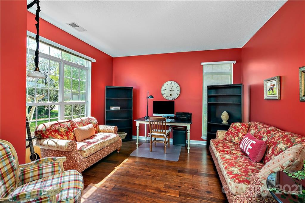 883 Knightsbridge Road Fort Mill, SC 29708 - Photo 4 of 20 a bedroom with a bed and wooden floor