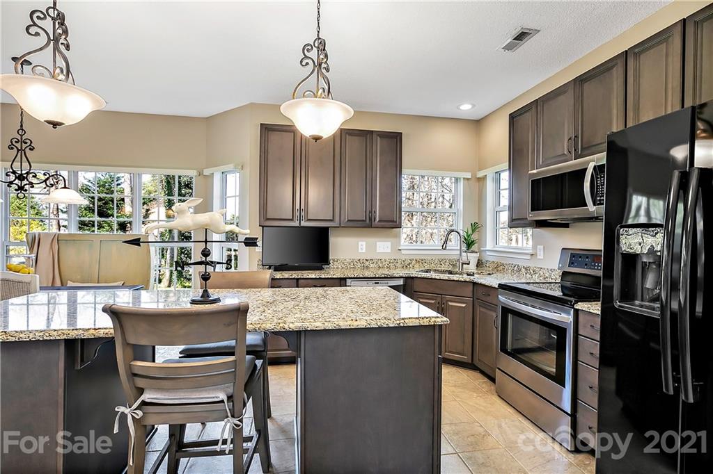 883 Knightsbridge Road Fort Mill, SC 29708 - Photo 5 of 20 a kitchen with a center island appliances and cabinets