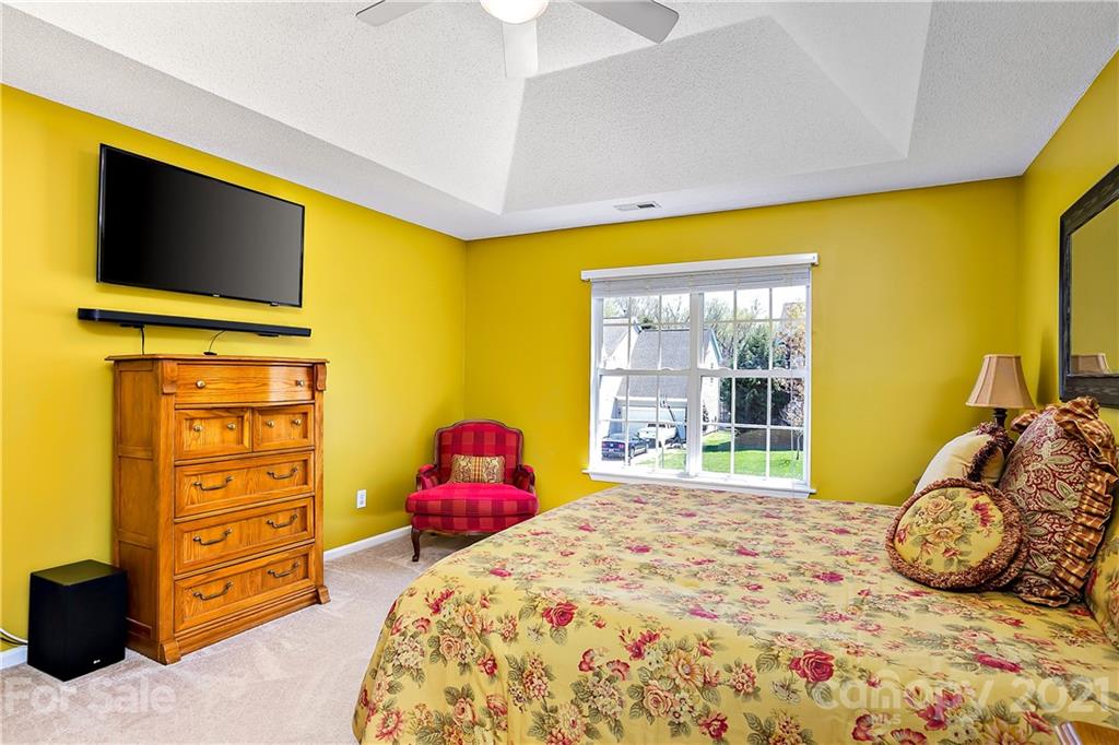 883 Knightsbridge Road Fort Mill, SC 29708 - Photo 10 of 20 a bedroom with a bed and wooden floor
