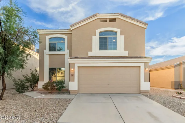 a front view of a house with yard