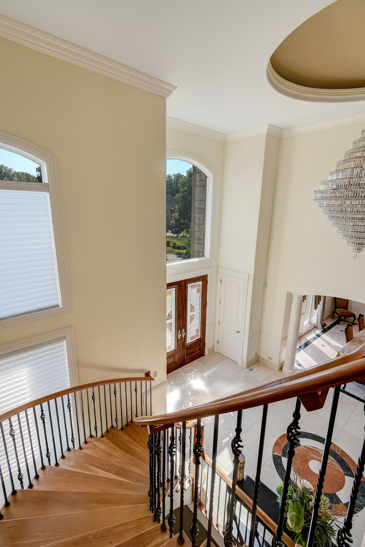 21 Ashton Drive Burr Ridge, IL 60527 - Photo 13 of 45 a view of balcony with wooden floor