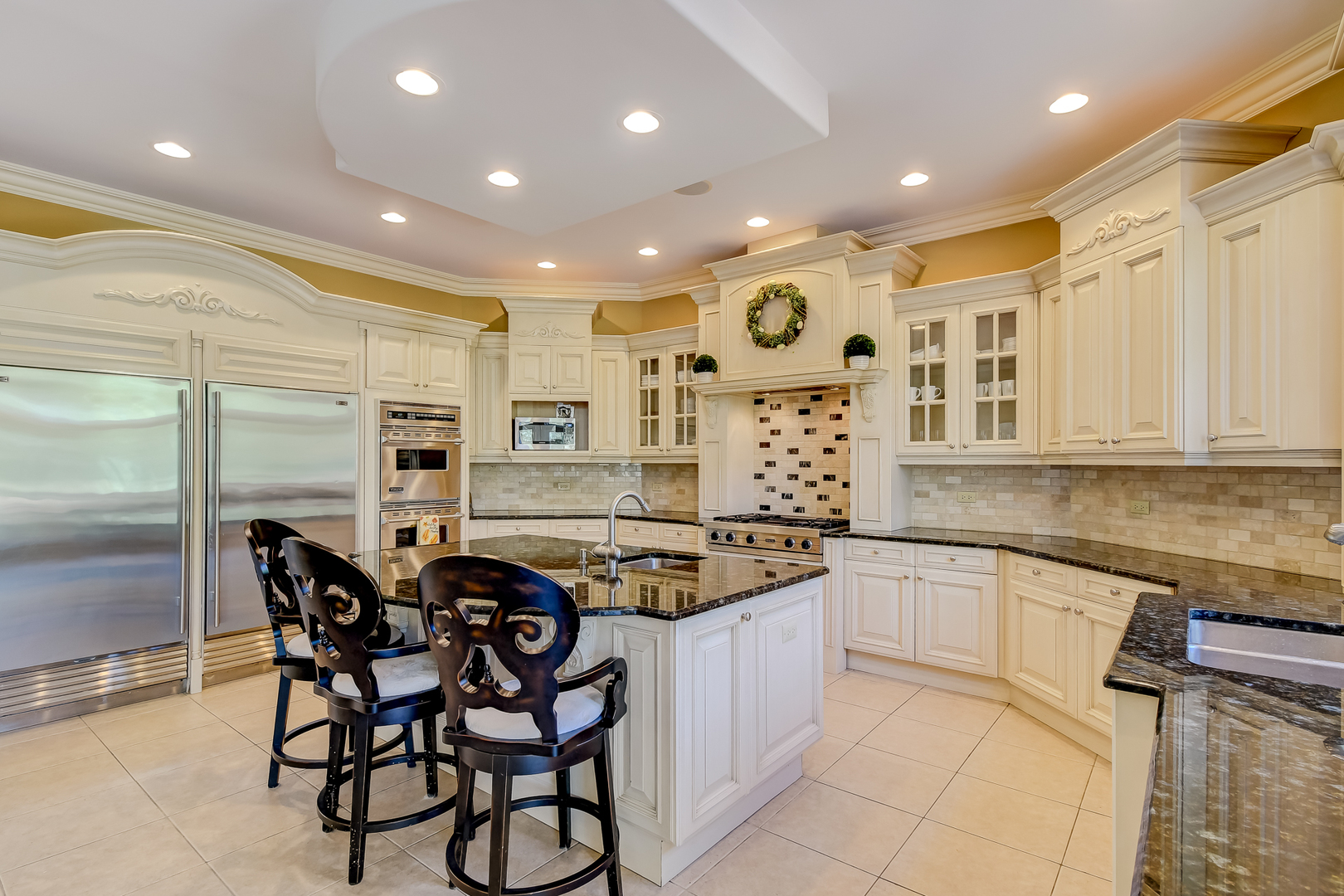 21 Ashton Drive Burr Ridge, IL 60527 - Photo 8 of 45 a kitchen with stainless steel appliances granite countertop a sink and cabinets