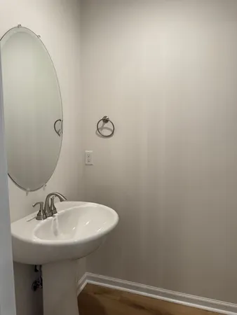 a bathroom with a sink and mirror