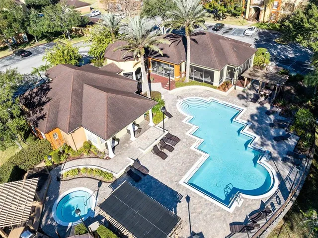 an aerial view of residential house with outdoor space and parking