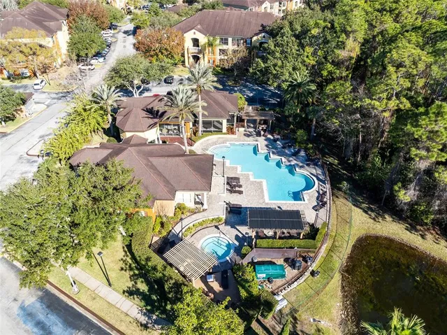 an aerial view of residential houses with outdoor space