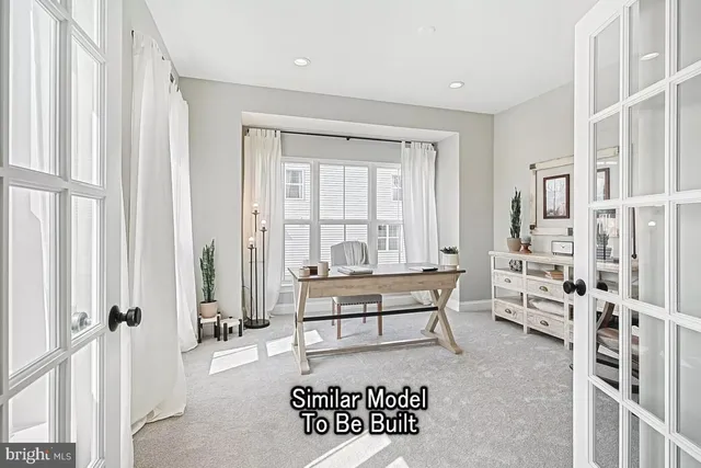 a living room with furniture a large window and a table