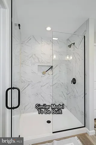 a bathroom with a shower and a sink
