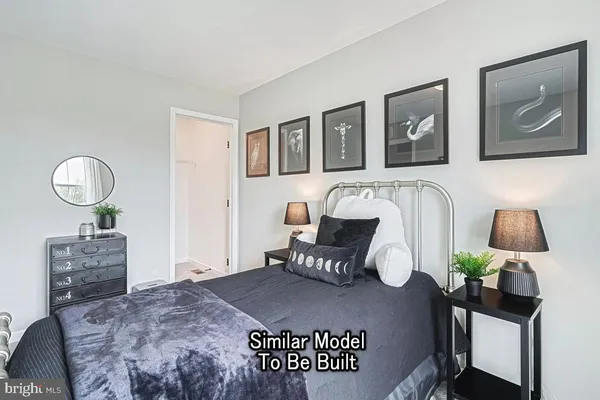 a bedroom with a bed and dresser