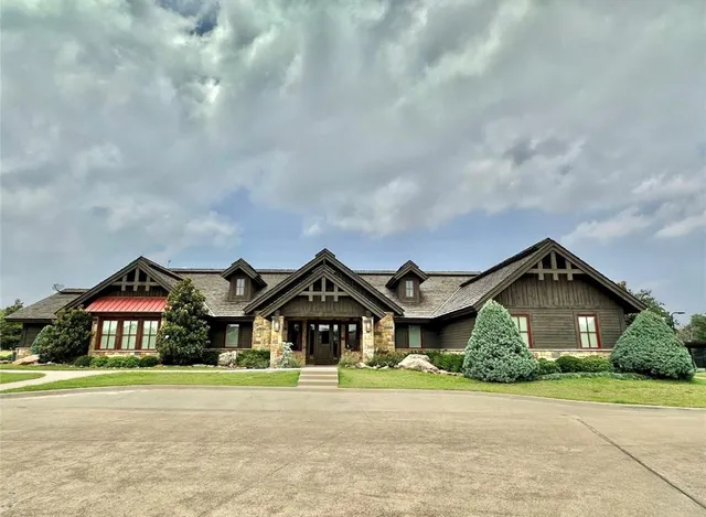 a front view of house with yard and green space