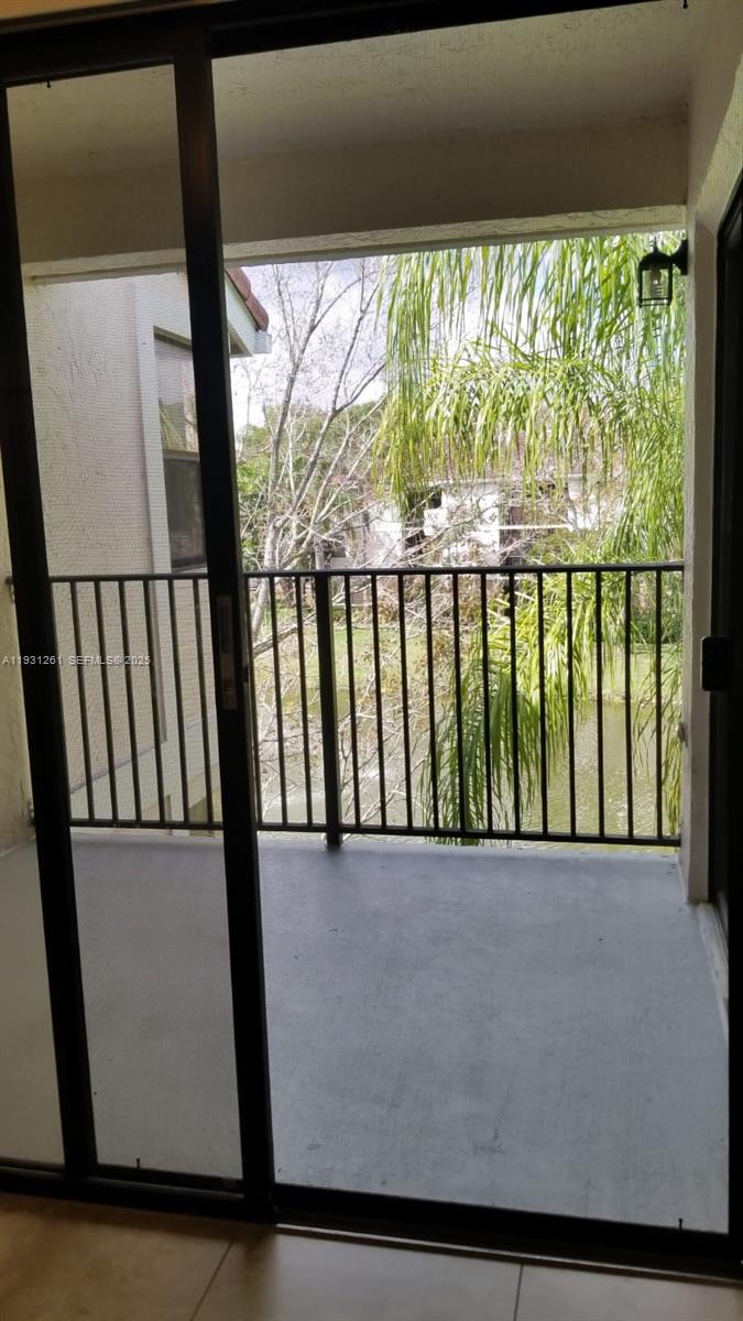 Jacaranda Plantation, FL 33322 - Photo 6 of 12 a view of a balcony with outdoor space