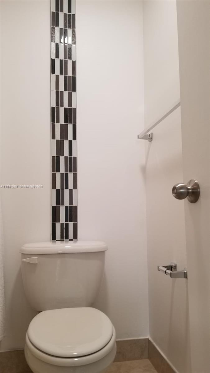 Jacaranda Plantation, FL 33322 - Photo 7 of 12 a bathroom with a toilet and a shower