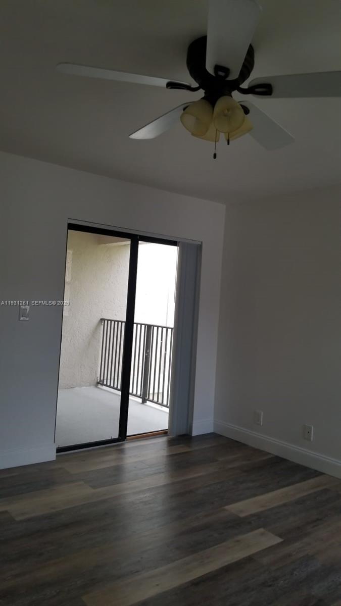 Jacaranda Plantation, FL 33322 - Photo 9 of 12 a view of empty room with wooden floor and fan