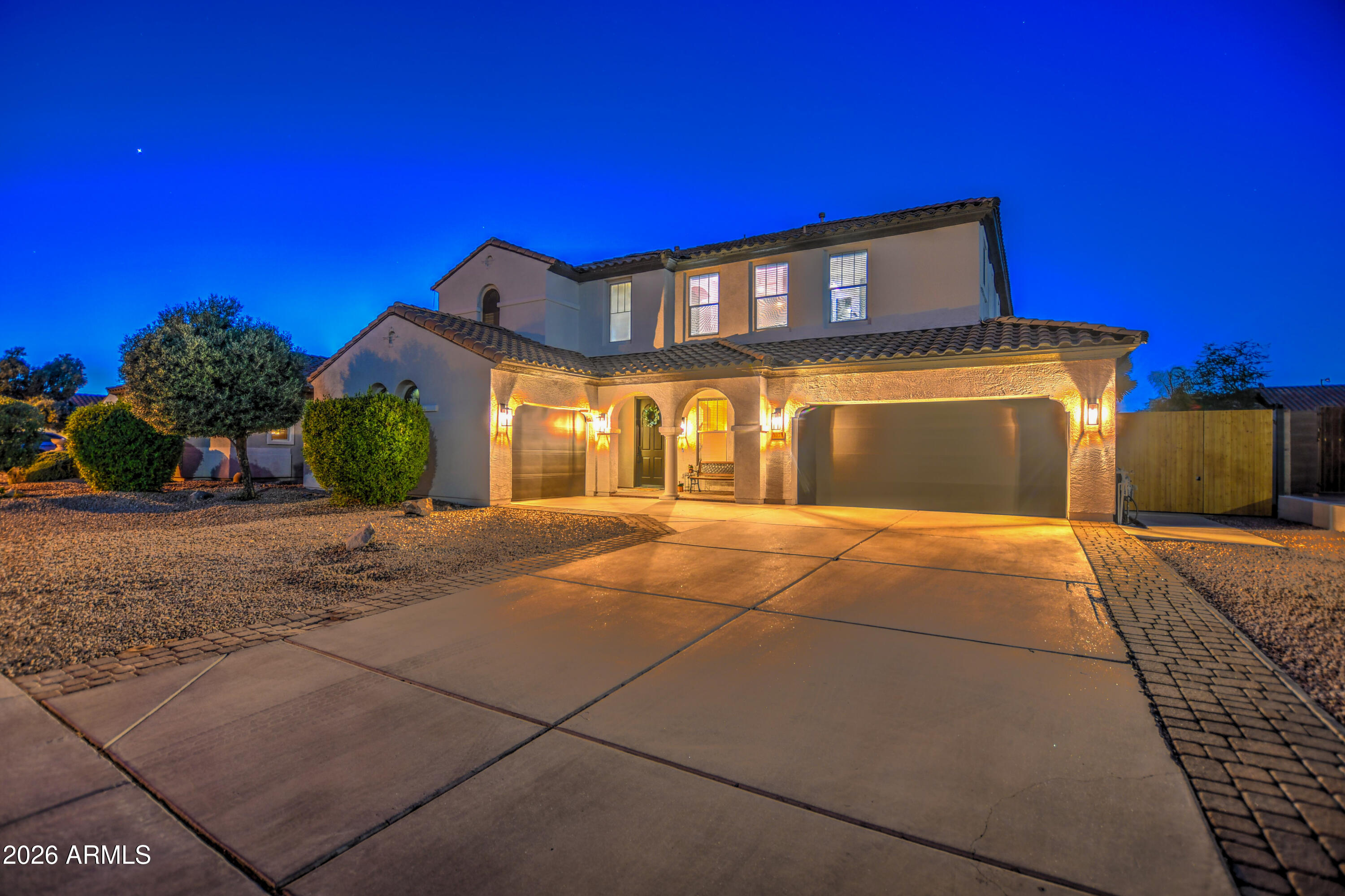 3078 East Muirfield Street Gilbert, AZ 85298 - Photo 3 of 92 a front view of a house with a yard
