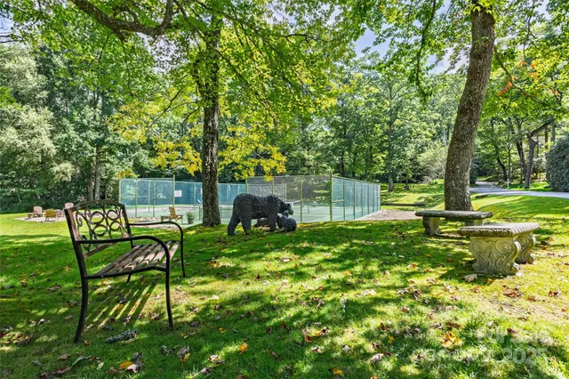 a view of yard with green space and seating area