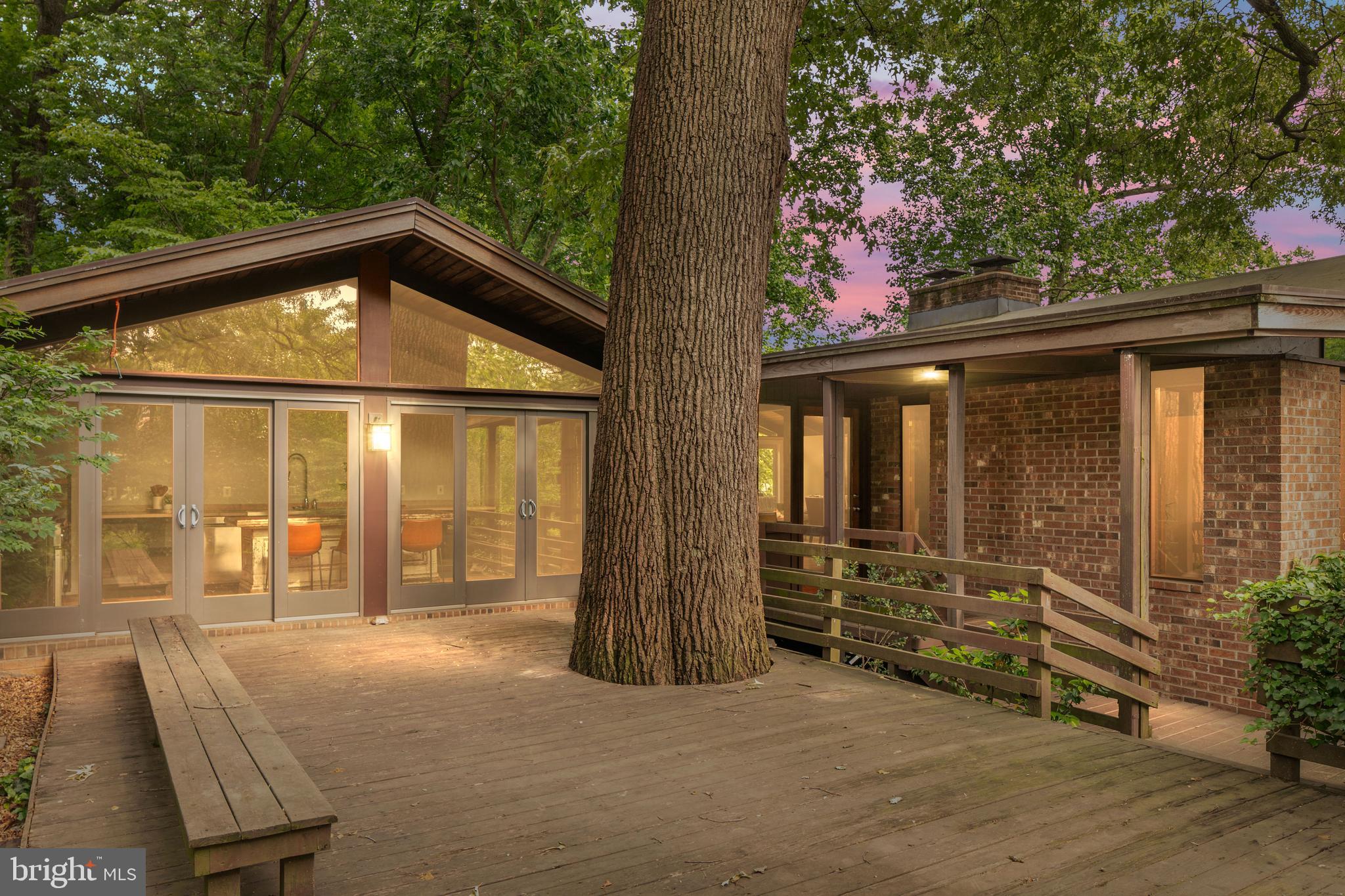 2825 Lorcom Lane Arlington, VA 22207 - Photo 2 of 63 a backyard of a house with barbeque oven table and chairs