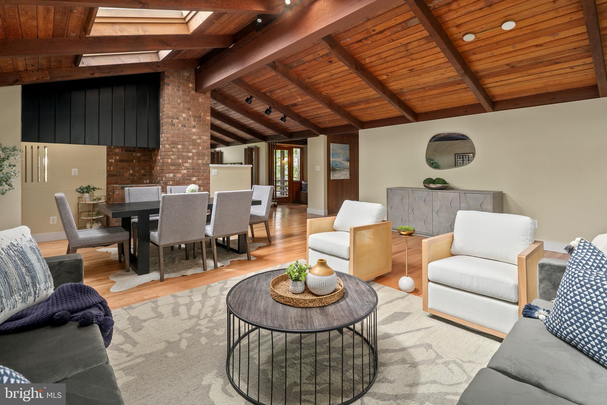 2825 Lorcom Lane Arlington, VA 22207 - Photo 32 of 63 a living room with furniture a window and a fireplace