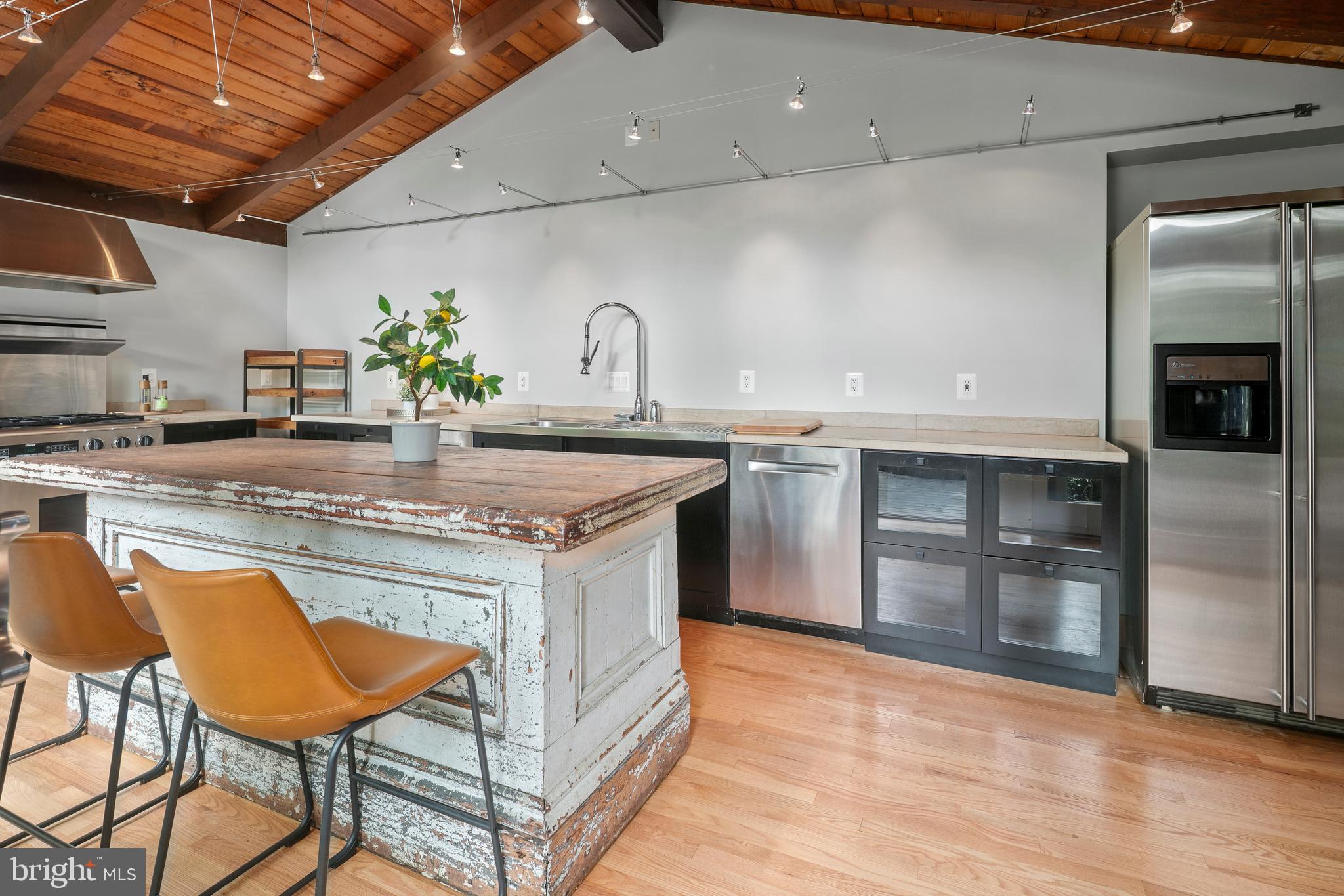 2825 Lorcom Lane Arlington, VA 22207 - Photo 39 of 63 a kitchen with granite countertop a sink appliances and cabinets