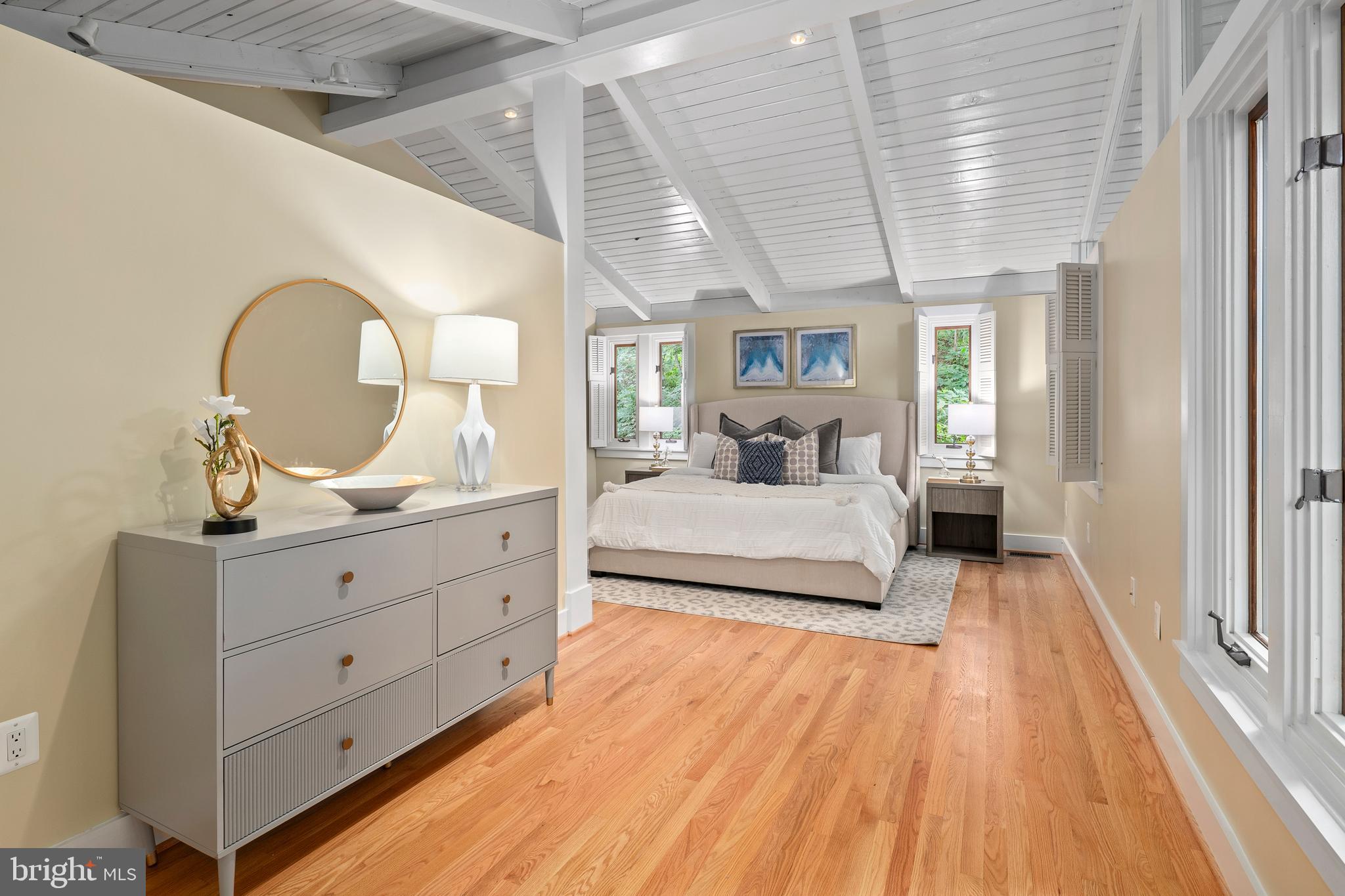 2825 Lorcom Lane Arlington, VA 22207 - Photo 43 of 63 a bedroom with a large bed and wooden floor