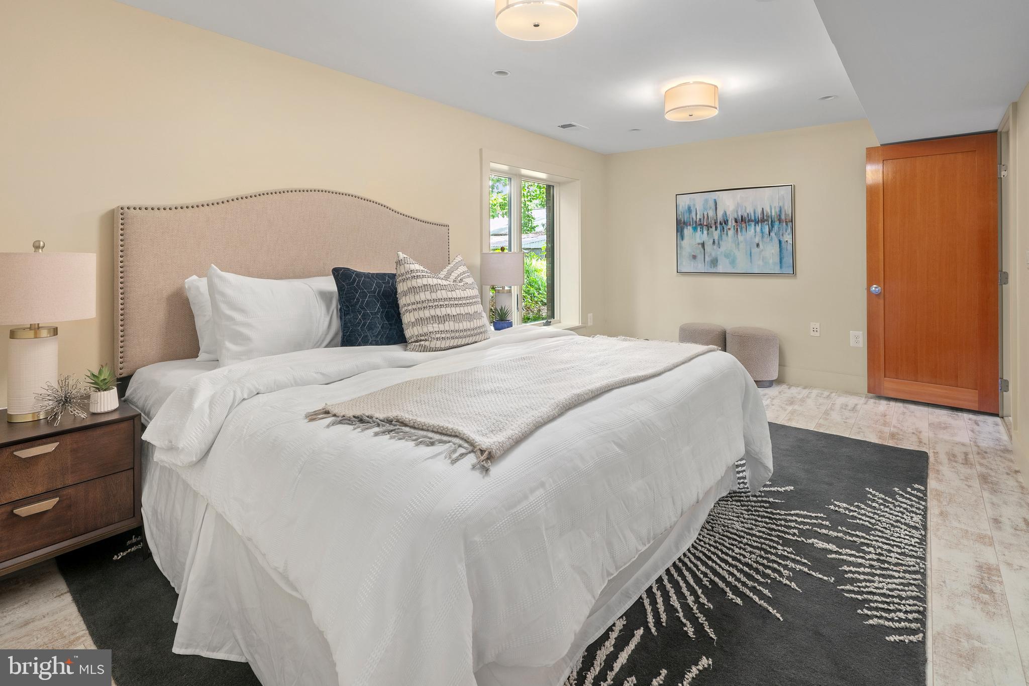 2825 Lorcom Lane Arlington, VA 22207 - Photo 52 of 63 a large bed sitting in a bedroom next to a window