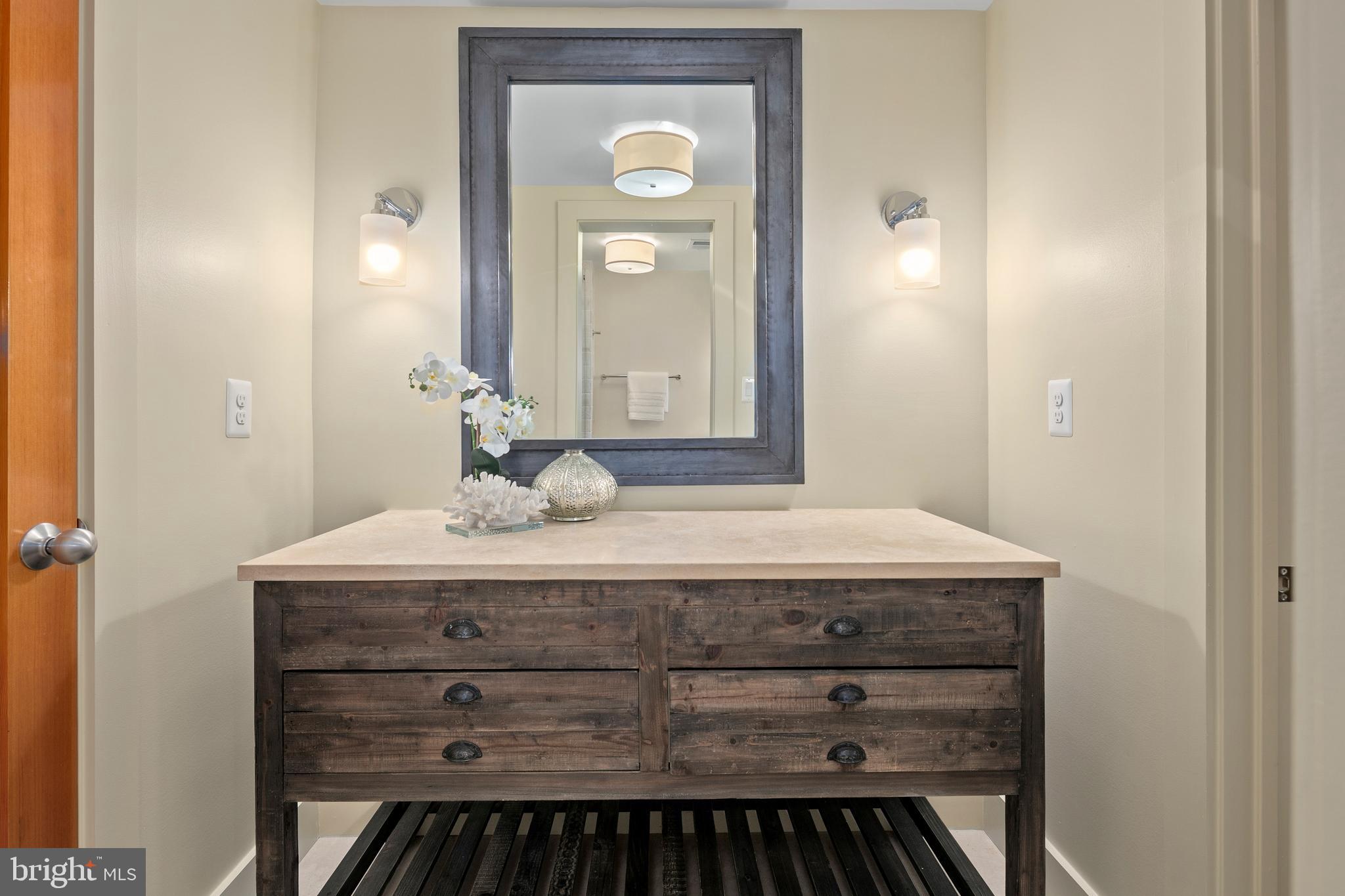 2825 Lorcom Lane Arlington, VA 22207 - Photo 54 of 63 a bathroom with a granite countertop sink and a mirror