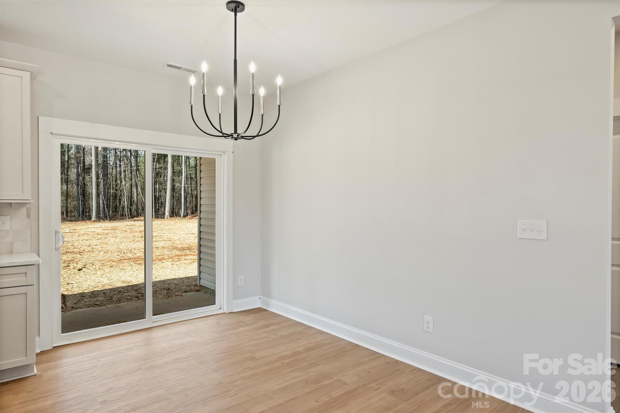 2279 Lee Lawing Road Lincolnton, NC 28092 - Photo 17 of 41 a view of a room with wooden floor and windows